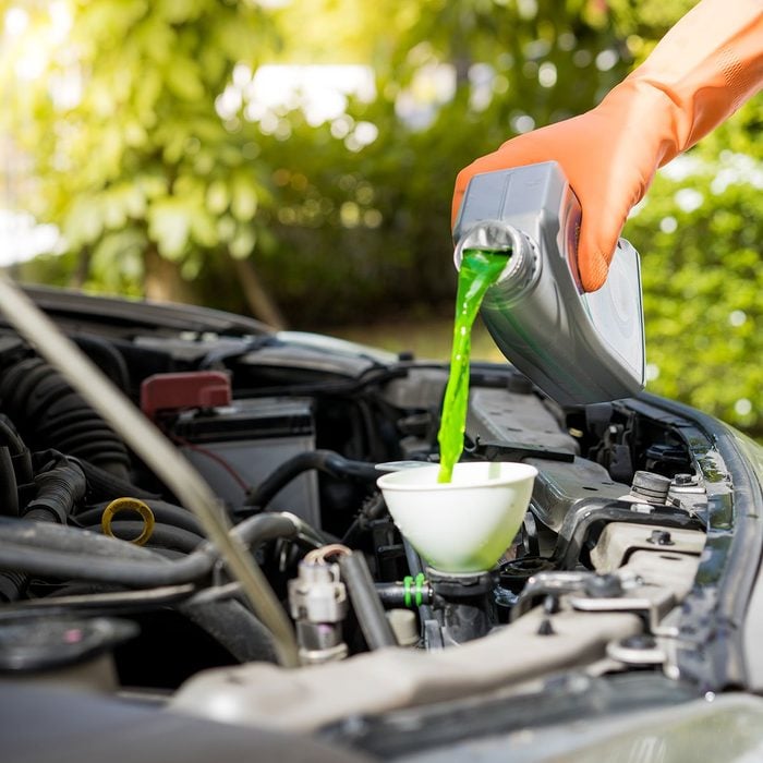 green antifreeze poured into coolant system