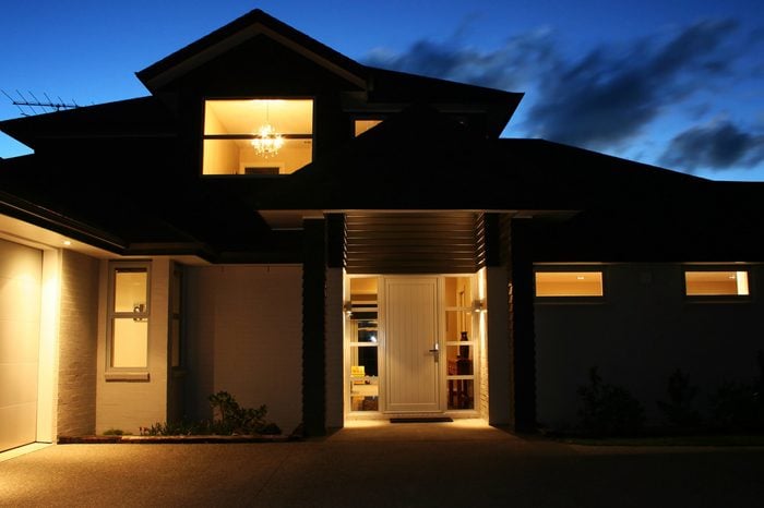 A modern house front entrance at night