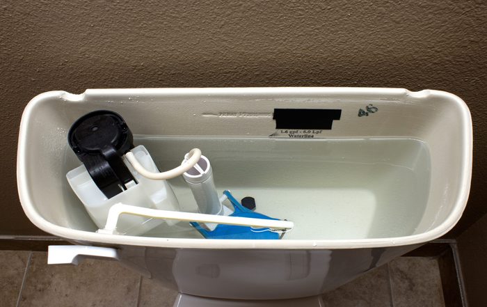 The internal mechanics of a modern flush toilet.