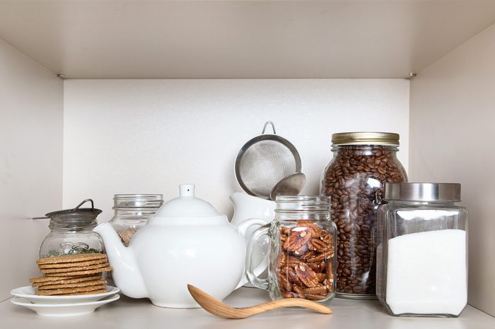 Sugar, tea , cookies and coffee beans for breakfast in pantry shelf