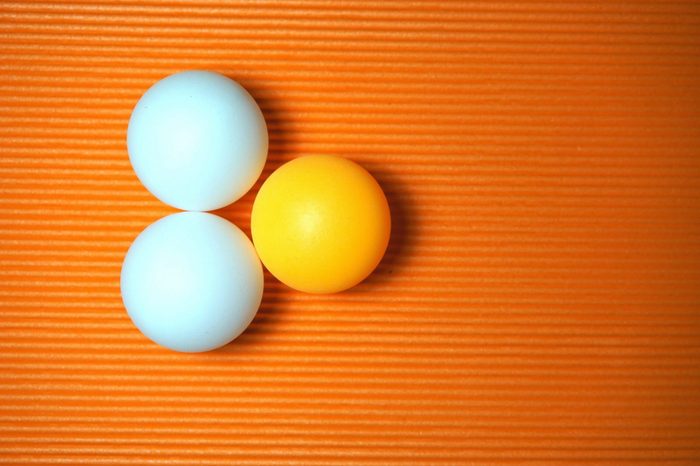 Ping Pong balls on the orange background