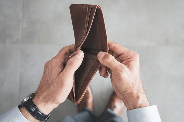 Man hand holding empty wallet 