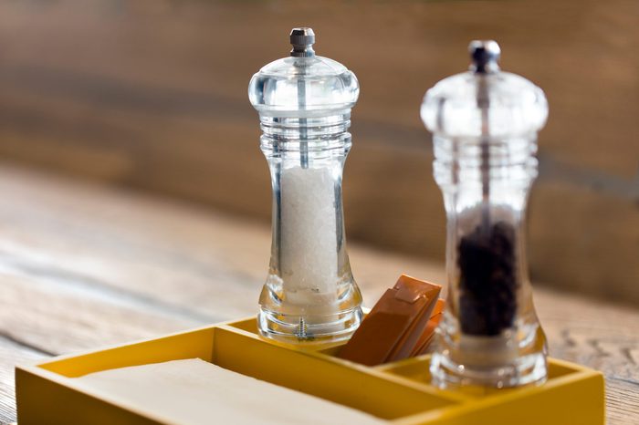 Salt and black pepper shakers on a table