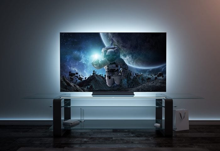 scifi movie on tv Blank white tv screen interior in darkness mockup, front view, 3d rendering. Empty telly plasma mokcup display in living room mock up. Clear smart panel monitor mokc on glass shelf template.; Shutterstock ID 1290402403; Job (TFH, TOH, RD, BNB, CWM, CM): RD
