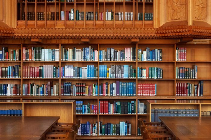 LEUVEN, BELGIUM - SEPTEMBER 05, 2014: Wooden bookshelves in the historical library of the Catholic University in Leuven. The library is National treasure of Belgium since 1987.