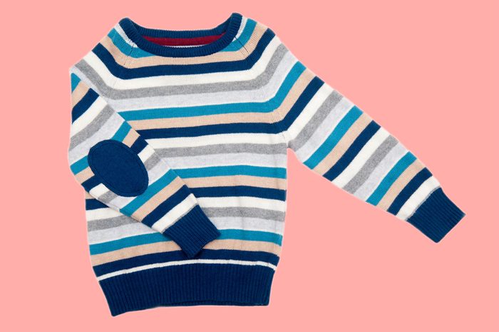 Children warm sweater on a white isolated background elbow patch