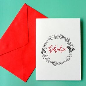 Top view hand drawn Christmas greeting cards with envelope.