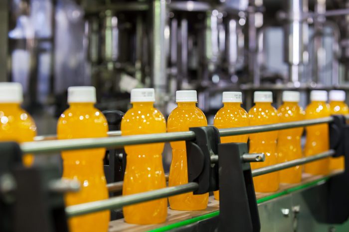 Orange Juice Bottles transfer on Conveyor Belt System