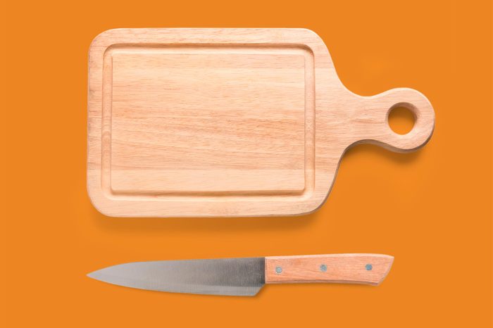 Mockup cutting board and knife set isolated on white background. Copyspace for text and logo. Clipping Path included on white background.