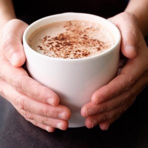 Handle hot cup of chocolate.; Shutterstock ID 575054329; Job (TFH, TOH, RD, BNB, CWM, CM): Taste of Home