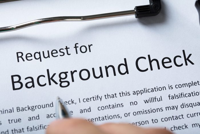 High Angel View Of Criminal Background Check Application Form With Pen