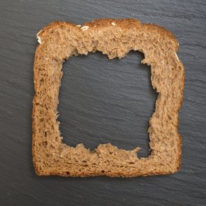 Whole grain sandwich bread slice with hole