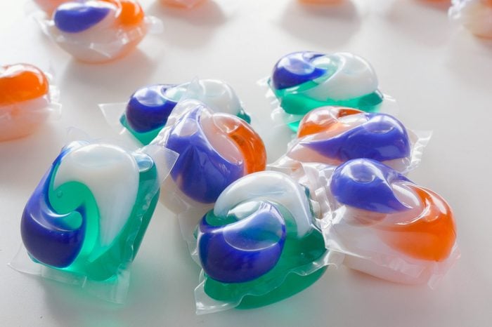 Colorful laundry detergent pods. The green, blue and orange household cleaning products are used in washing machines to clean clothes. A 2018 trend had teens eating the soap as a viral video challenge