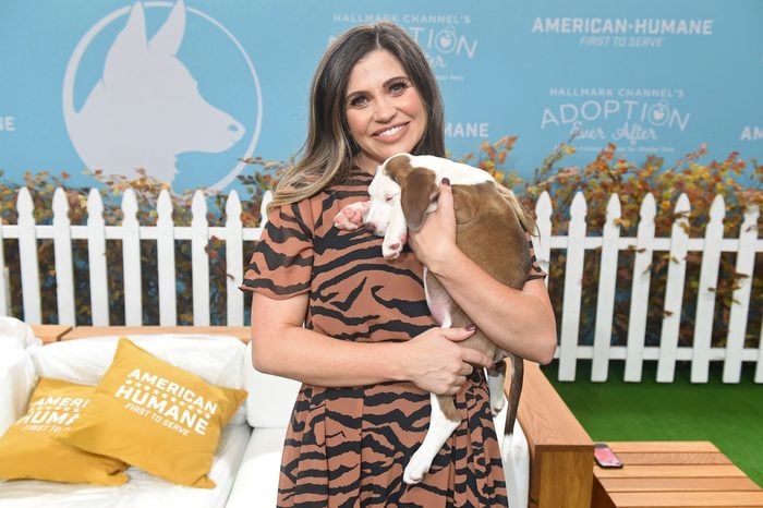 Danielle Fishel is seen holding a dog at the 2019 American Humane Hero Dog Awards at The Beverly Hilton, in Beverly Hills, California