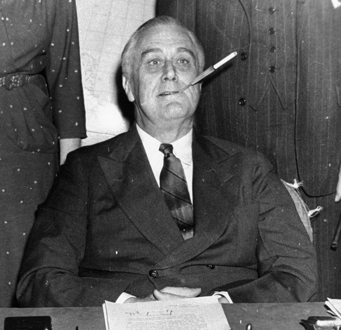 Mandatory Credit: Photo by Uncredited/AP/Shutterstock (6010767a) President Franklin D. Roosevelt poses for photographers with a cigarette in his mouth as he started his 11th year in the White House. He said, "Let's make one this way, boys." On Jan. 11, 1964, U.S. Surgeon General Luther Terry released an emphatic and authoritative report that said smoking causes illness and death - and the government should do something about it Smoking Report Anniversary, Washington, USA