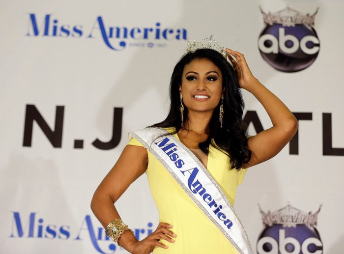 Mandatory Credit: Photo by Mel Evans/AP/Shutterstock (6199142a) Nina Davuluri Miss America Nina Davuluri poses for photographers following her crowning in Atlantic City, N.J. For some who observe the progress of people of color in the U.S., Davaluri's victory in the Miss America pageant shows that Indian-Americans can become icons even in parts of mainstream American culture that once seemed closed Miss America New Kind of Icon, Atlantic City, USA