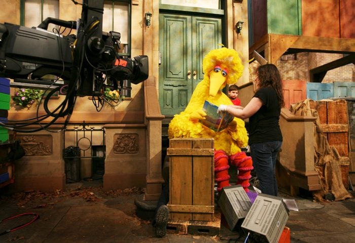 Mandatory Credit: Photo by Mark Lennihan/AP/Shutterstock (6359732b) Caroll Spinney, Big Bird Michelle Hickey, a Muppet wrangler adjusts a book for Big Bird, voiced by Carroll Spinney, so he can read to Connor Scott during a taping of Sesame Street in New York. Spinney drops his fine-feathered obscurity (and emerges from his garbage-can fortress as Oscar the Grouch) for an enchanting film portrait, "I Am Big Bird: The Caroll Spinney Story," which celebrates the "Sesame Street" puppet master who, at age 81, continues to breathe life into a pair of the world's best-loved personalities Film I Am Big Bird-Spinney, New York, USA