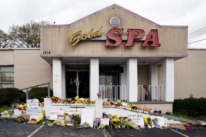 Flowers adorn Gold Spa during a demonstration against violence against women and Asians following Tuesday night's shooting where three women were gunned down on March 18, 2021 in Atlanta, Georgia.