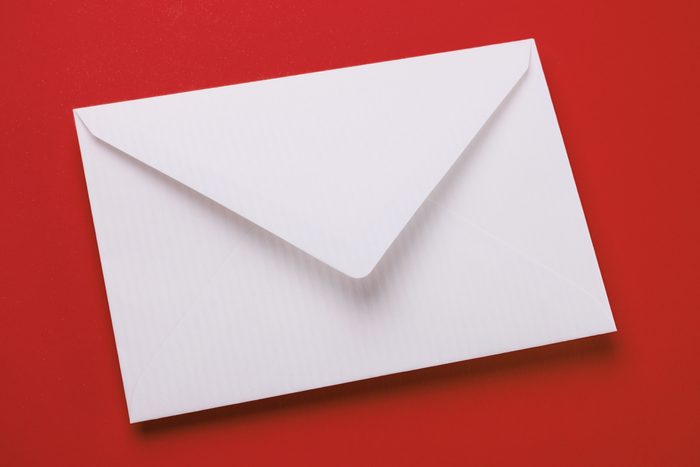 plain white envelope on red background