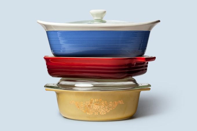 stack of casserole dishes on blue background