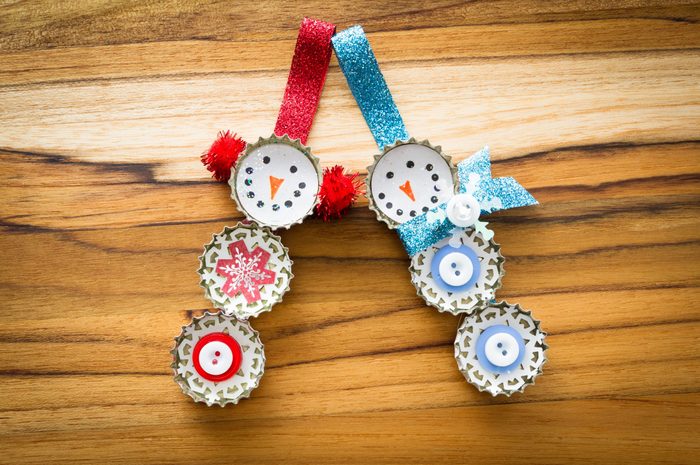 cute hand made recycled christmas ornaments on a wooden table