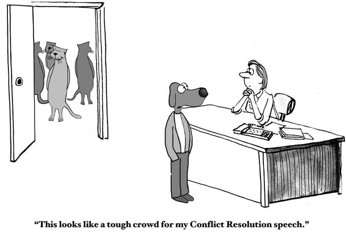 Business cartoon of business cats in background and business dog in foreground, 'This looks like a tough crowd for my Conflict Resolution speech'.