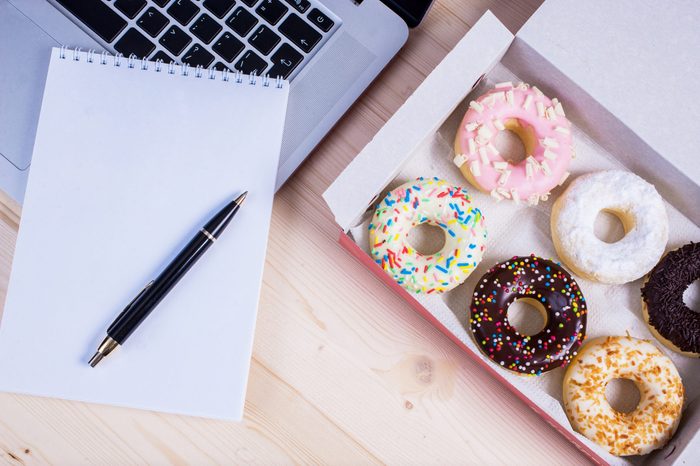 Donuts with notebook and pencil