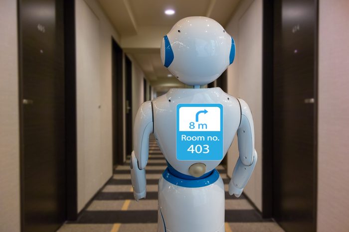 smart hotel in hospitality industry 4.0 technology concept, robot butler (robot assistant) use for greet arriving guests, deliver customer, items to rooms, give information, support variety languages