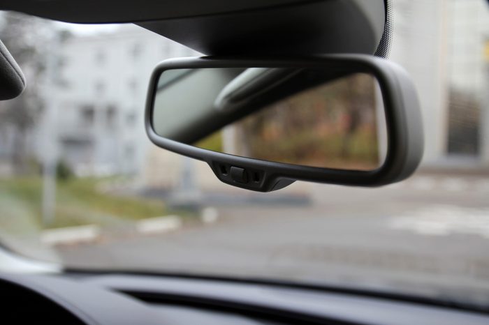Rearview mirror on the windshield of the car