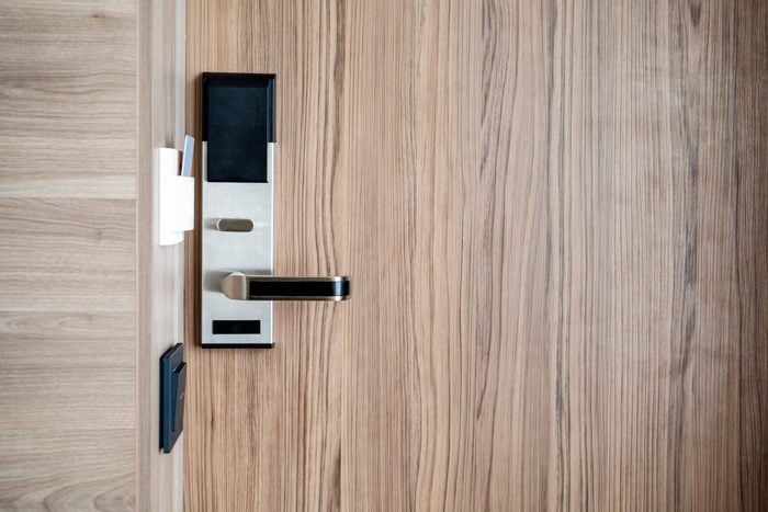 Electronic card smart lock on wooden door at the hotel for power