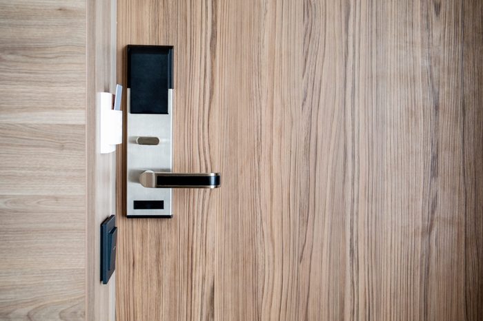 Electronic card smart lock on wooden door at the hotel for power
