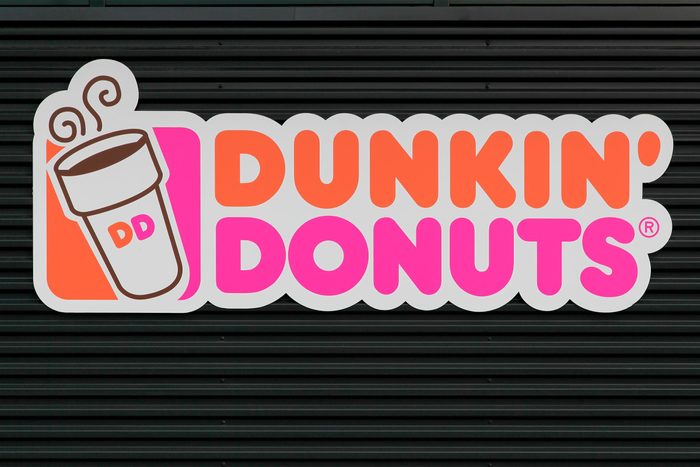 Dunkin' Donuts sign on a wall.