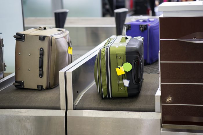 Luggage on weight at check-in counter at airport