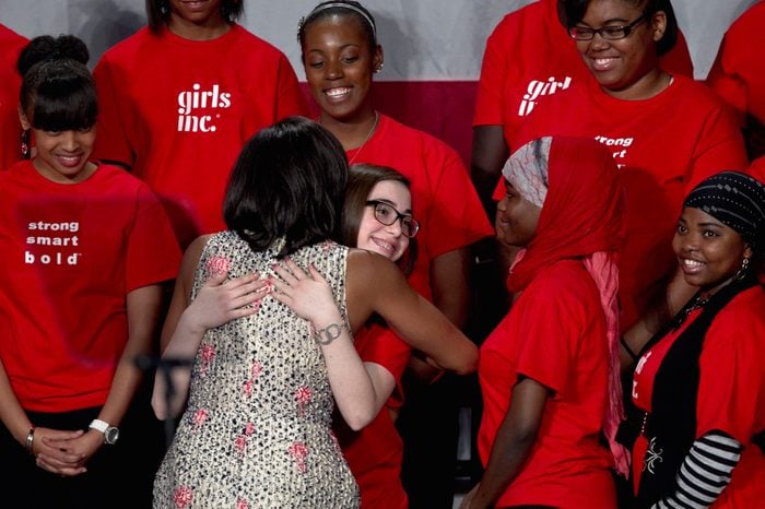 Michelle Obama First lady Michelle Obama hugs an unidentified girl, member of Girls Inc., after speaking at a fundraising lunch for the charity Girls Inc., in Omaha, Neb 24 Apr 2012