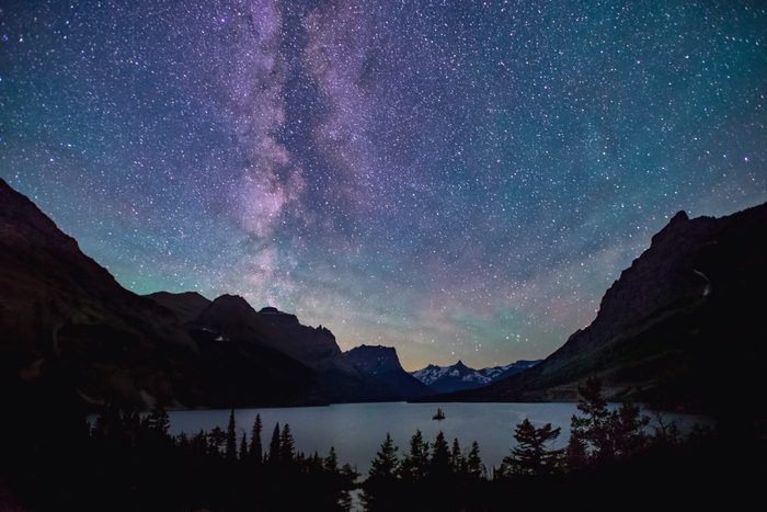 milky way above saint mary lake in glacier national park, montana, on summer night