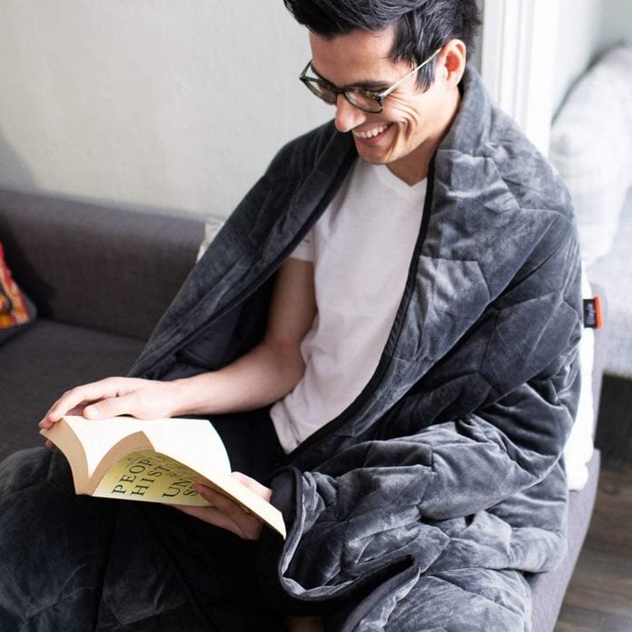 man wearing the Layla Weighted Blanket