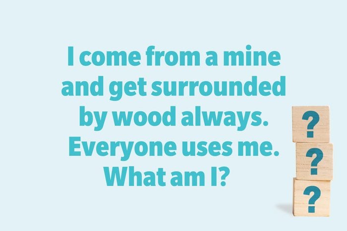 I come from a mine and get surrounded by wood always. Everyone uses me. What am I? 