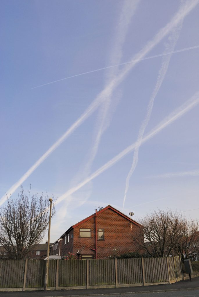 Mandatory Credit: Photo by Photofusion/Shutterstock (2283305a) Model Released - vapor trails or chemtrails from jets in sky often forming grid or triangular patterns Pollution