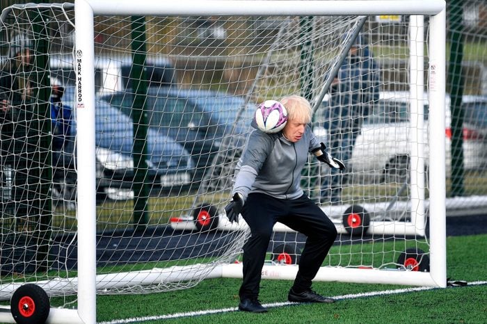 Britain's Prime Minister Boris Johnson stands in goal prior to a Juniors girls' soccer match between Hazel Grove United JFC and Poynton, as he campaigns in Cheadle Hulme, England, . Britain goes to the polls on Dec. 12 Brexit Election, Cheadle Hulme, United Kingdom - 07 Dec 2019