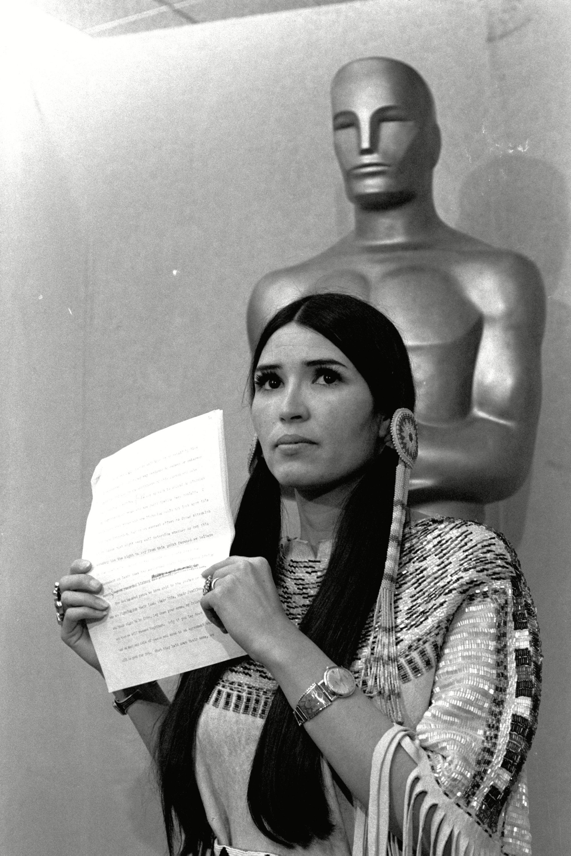 Mandatory Credit: Photo by Uncredited/AP/Shutterstock (9427895a) Oscars Brando. Sacheen Littlefeather, tells the audience at the Academy Awards ceremony that Marlon Brando was declining to accept his Oscar as best actor for his role in "The Godfather." The move was meant to protest Hollywood's treatment of American Indians Oscars-Politics, LOS ANGELES, USA - 27 Mar 1973