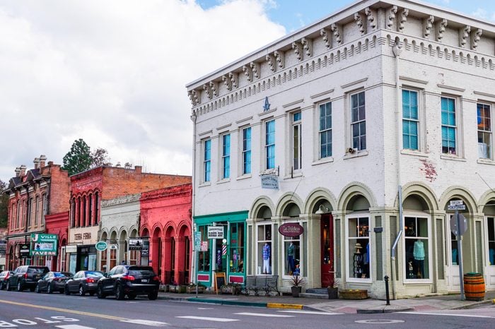 Jacksonville, Oregon USA - March 28, 2019: Downtown Historic District brick buildings with 1874 Masonic Lodge, foreground, corner of California and Oregon Streets, old 19th century construction