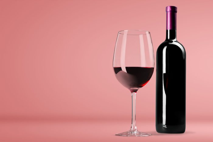 Red Wine in Bottle and Glass on white background