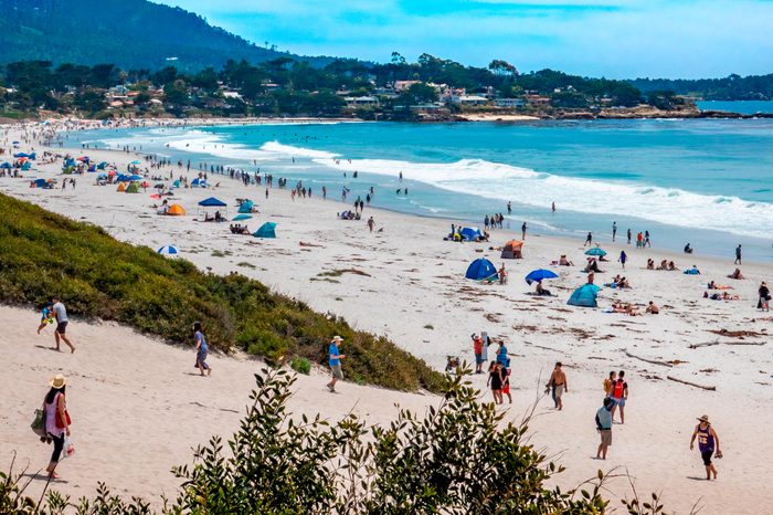 Carmel by the Sea, California - June 9, 2019: Large numbers of people flock to Carmel Beach during an early season heat wave.