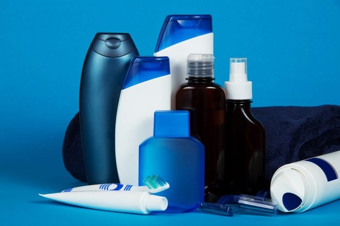Set of different men's cosmetics on a blue background