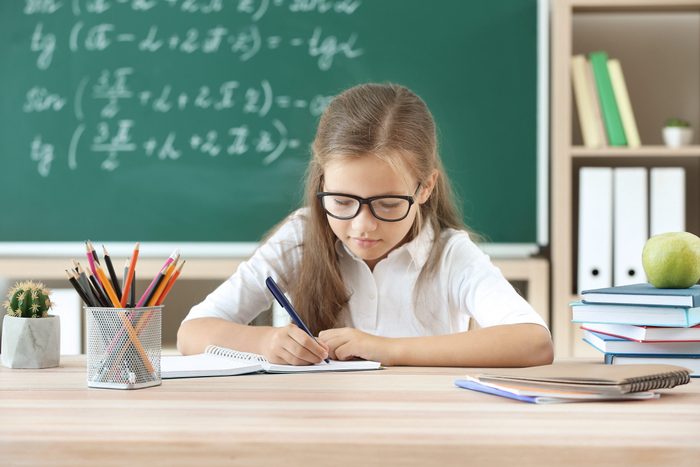 Little girl doing lessons in classroom; Shutterstock ID 1457601527; Job (TFH, TOH, RD, BNB, CWM, CM): RD