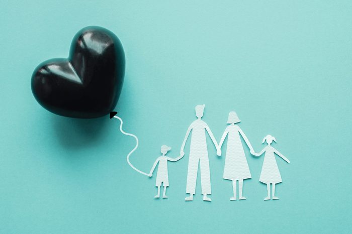 Family paper cut out and black heart balloon, causes and effects impact on child development and behavior of dysfunctional family, divorce parent, broken home concept, children mental illness health