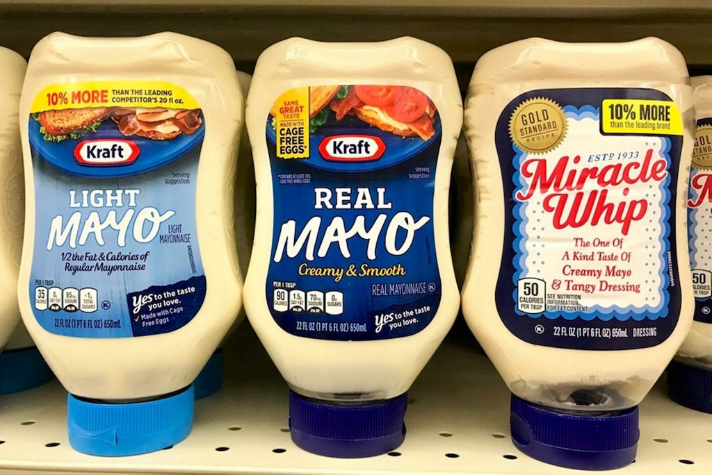 Several bottles of kraft mayonnaise on shelve at a grocery store