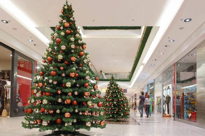 Shopping mall interior decorated with christmas trees