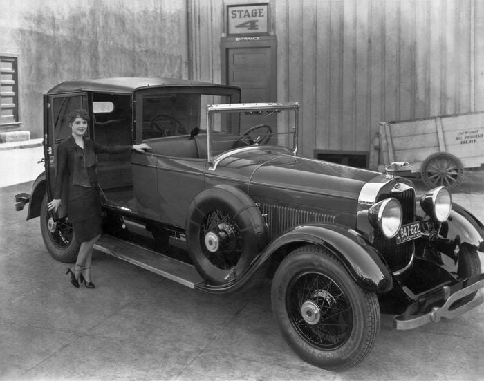 Mandatory Credit: Photo by Underwood Archives/Shutterstock (4437299a) Hollywood, California: 1927. A young woman prepares to enter the rear compartment of a 1927 Lincoln L-series towncar. VARIOUS