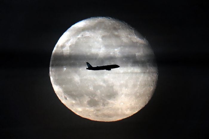 A commercial jet passes in front of the moon over Moscow, Russia, 14 November 2019. The full moon peaked 12 November 2019 and will wane until the new moon is reached on 26 November 2019. 14 Nov 2019